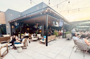 The rooftop at Culinary Dropout with lots of people hanging out and drinking.