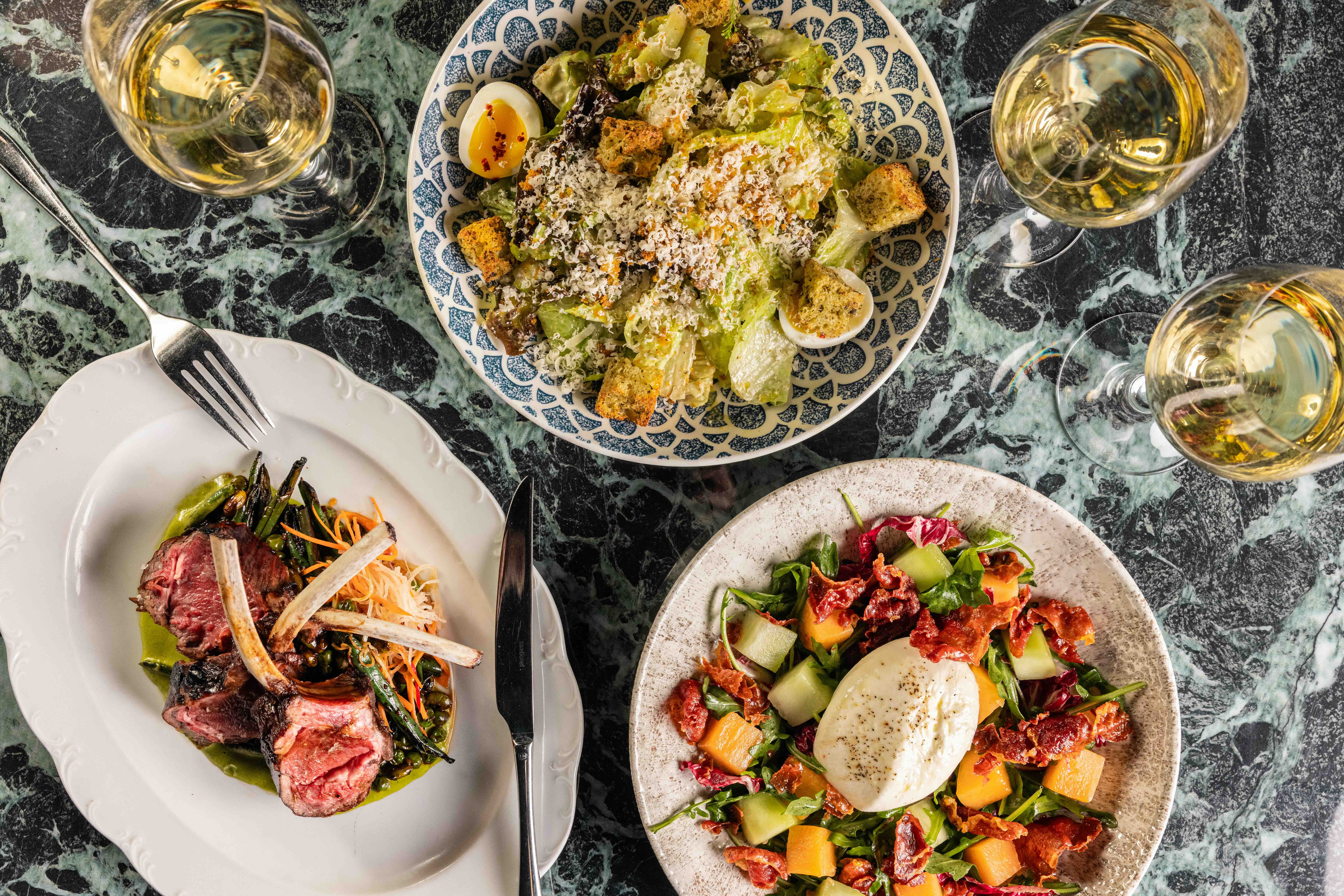 A table full of brunch dishes CATCH.