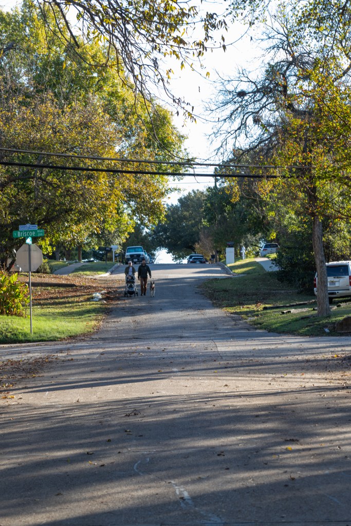 family walking in neighborhood