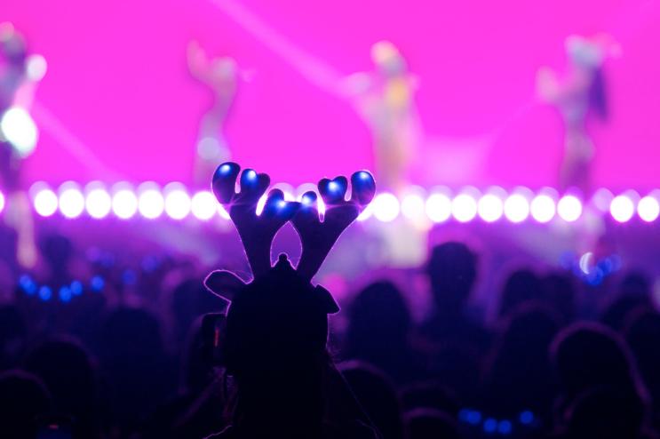 Man in reindeer lighted antlers at Jingle Ball in Fort Worth.