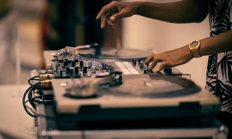 DJ spinning behind deck