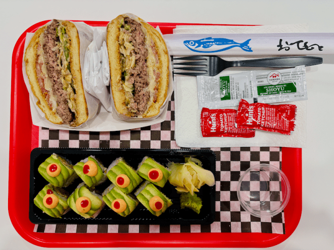 Doda Burger and Sushi tray of food.