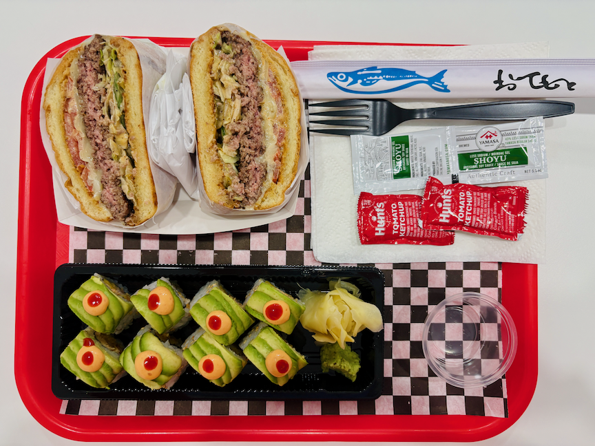 Doda Burger and Sushi tray of food.