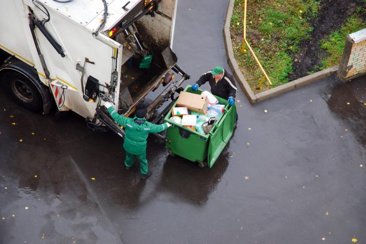 garbage truck picking up trash