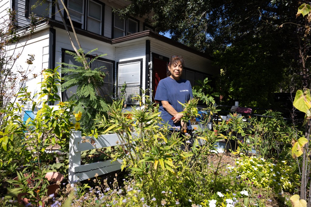 Woman in front of house near Texas border