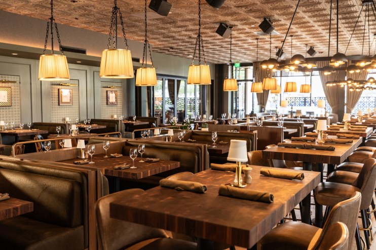 The interior of The Henry; lots of nice tables and warm lighting.