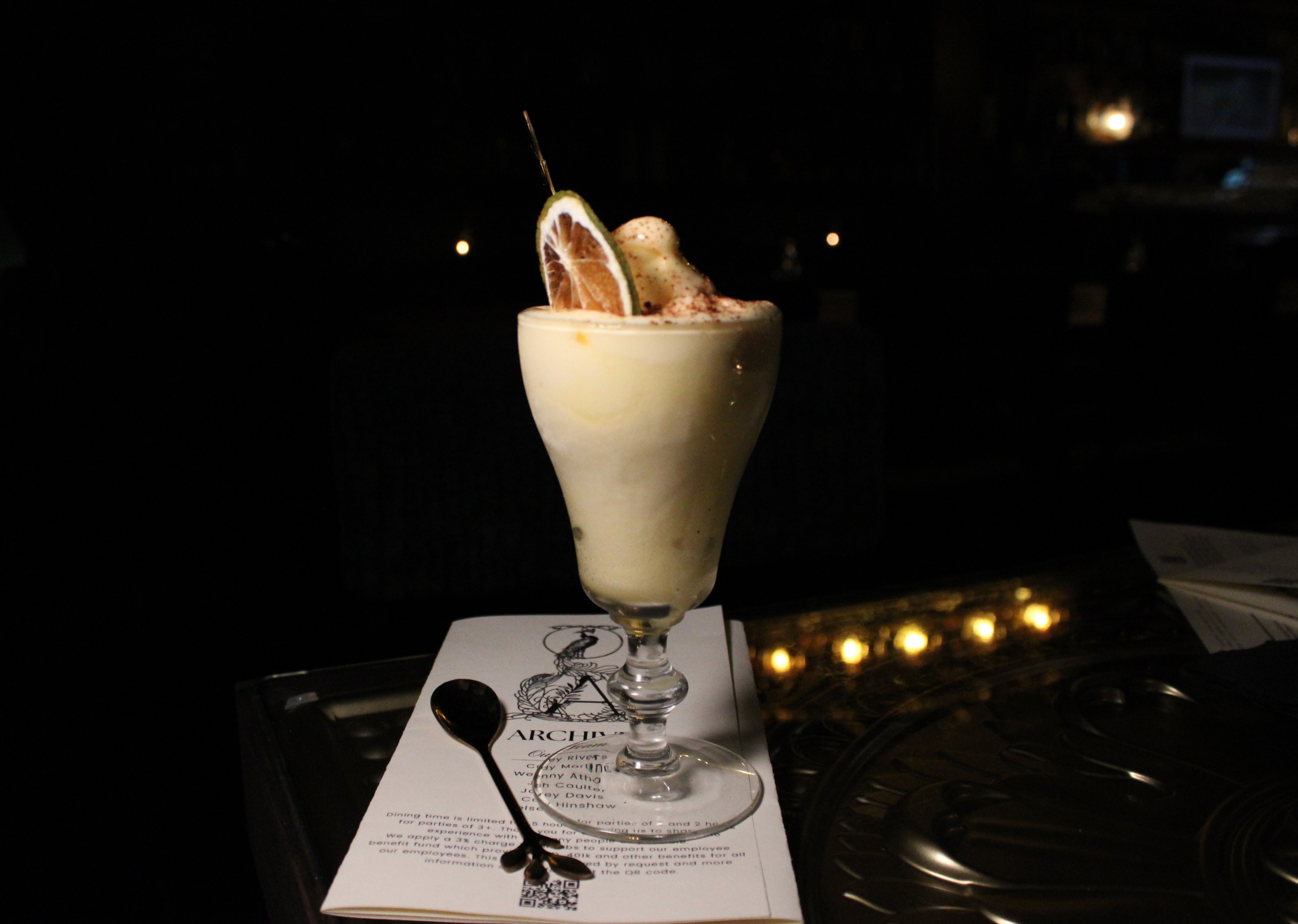 The soft serve margarita from Apothecary in a dainty glass.