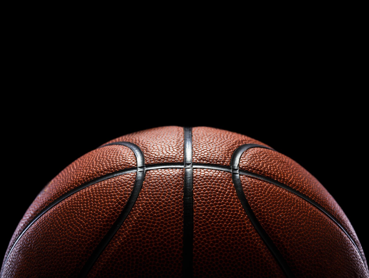 a basketball in a dark room