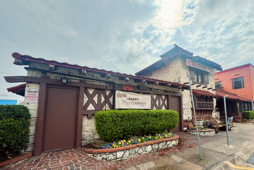 The east side of El Ranchito showcasing the heavy timber rafters and limestone walls.
