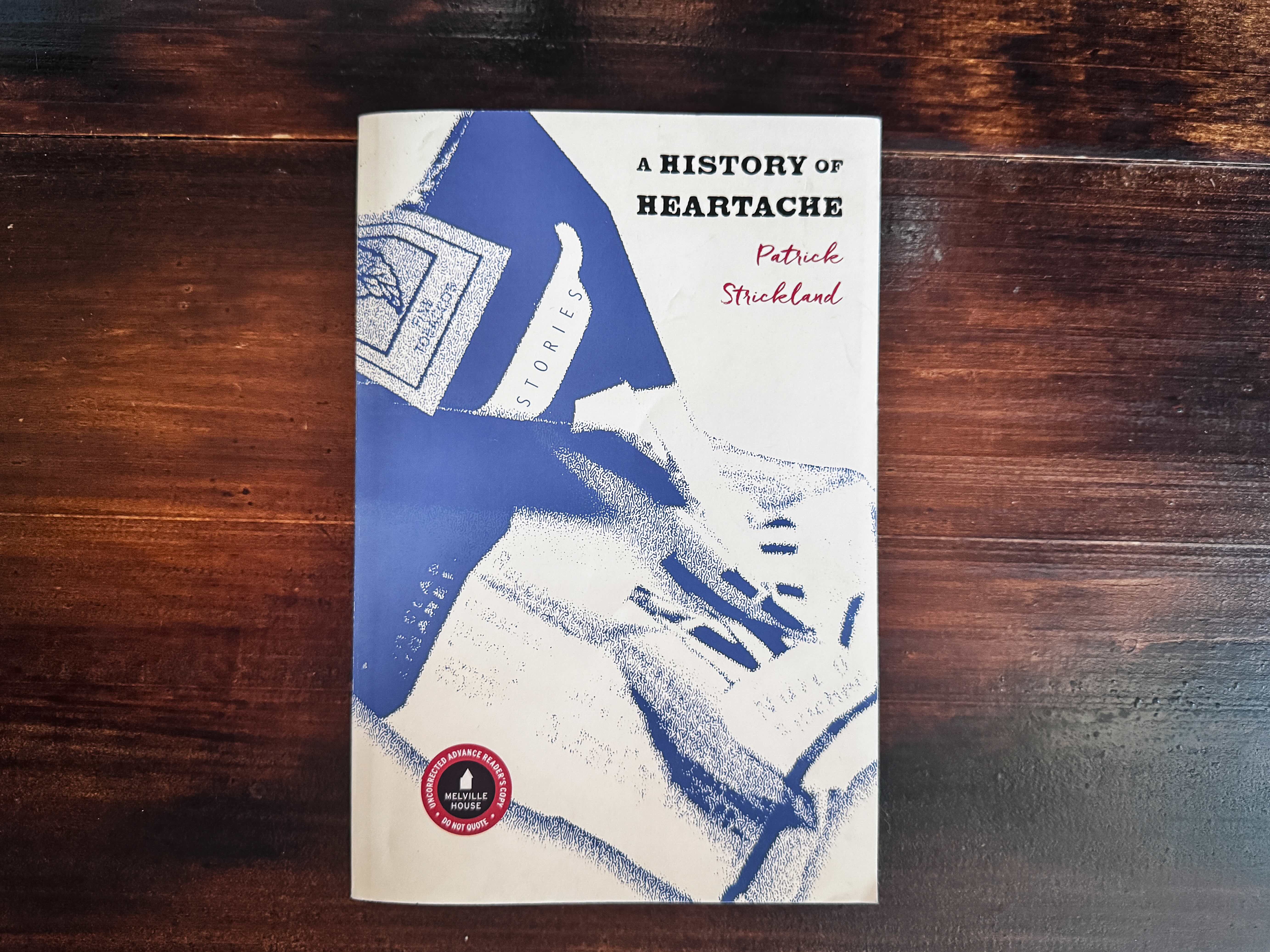 the cover of A History of Heartache, which has a crumpled up pack of Marlborough cigarettes