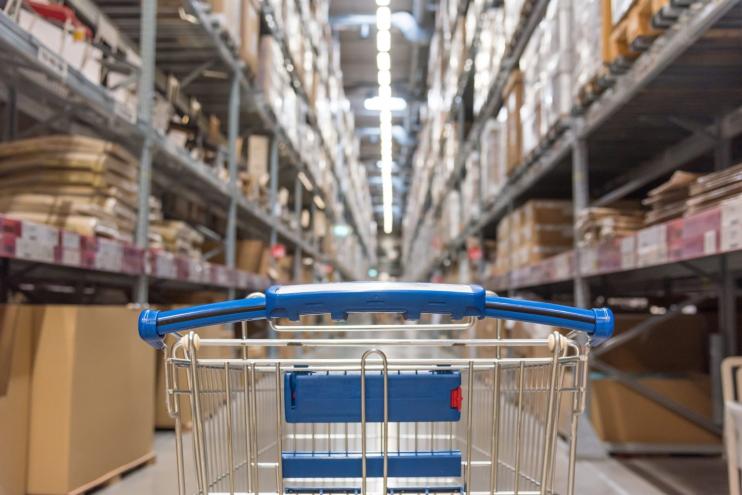 Shopping cart in a wholesale club aisle