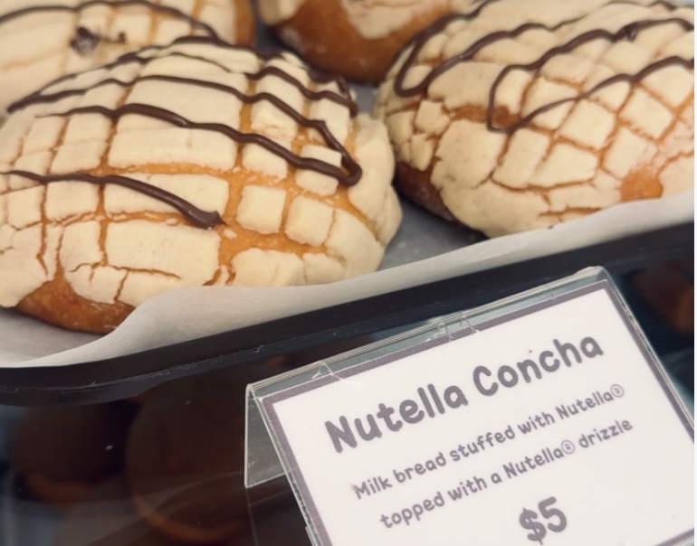a nutella concha with a drizzle of nutella on the top.