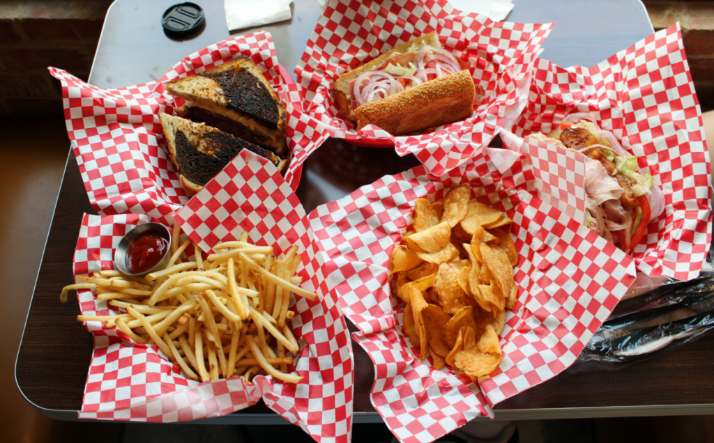 Seegar's spread with potato chips, Reuben, french fries and a club sandwich.