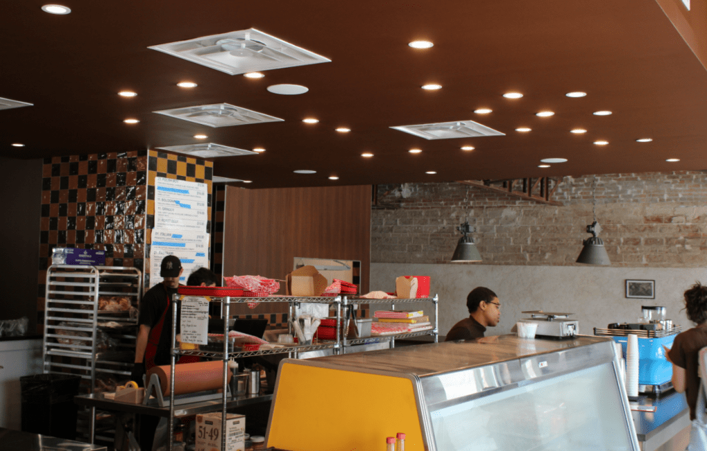 The deli counter of Seegar's with the noticeably fluid, tapped out menu in the background.