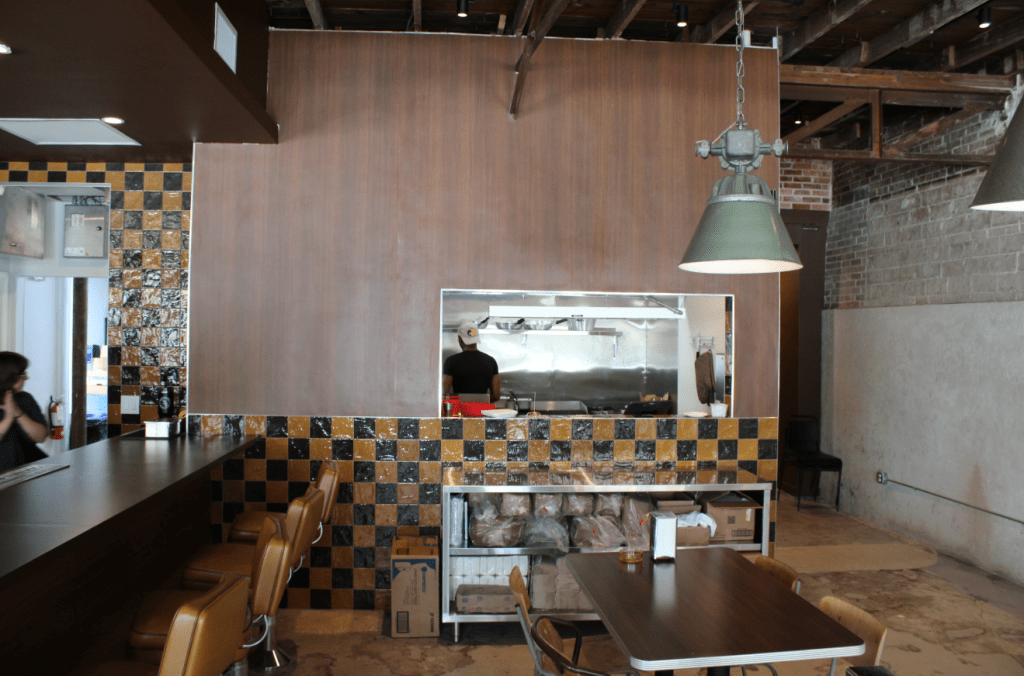 The food window of Seegar's with the deli lunch counter/bar to the left.