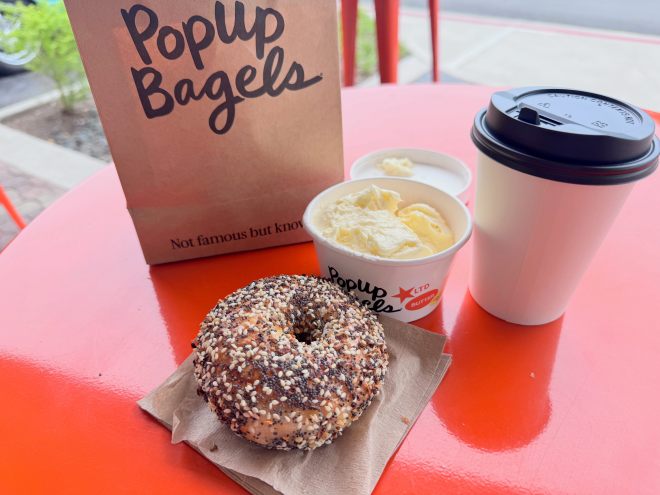 PopUp Bagels: a bagel and salted butter on a table outside.