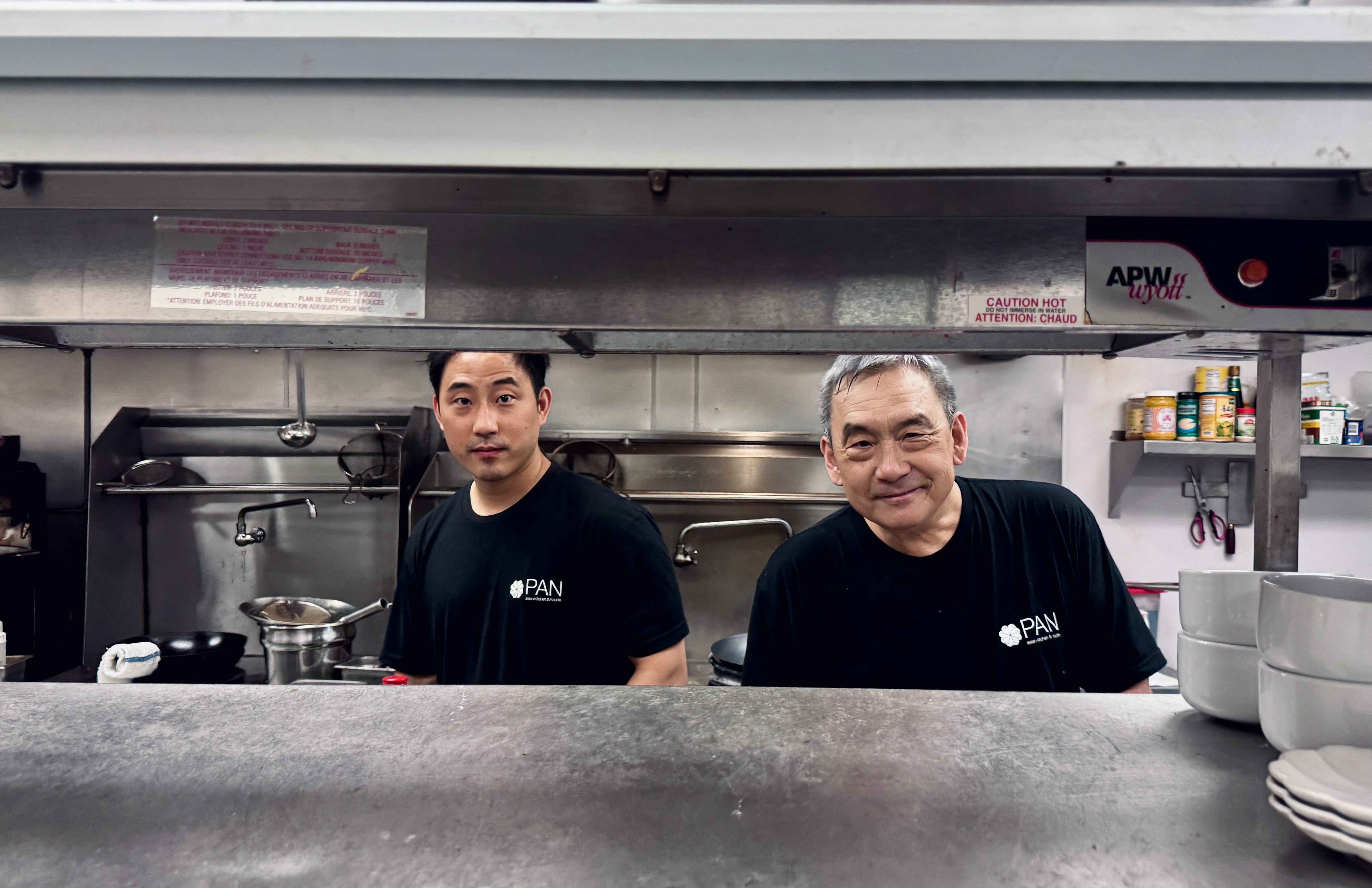 Howard Wang and his son Jarren in the kitchen.