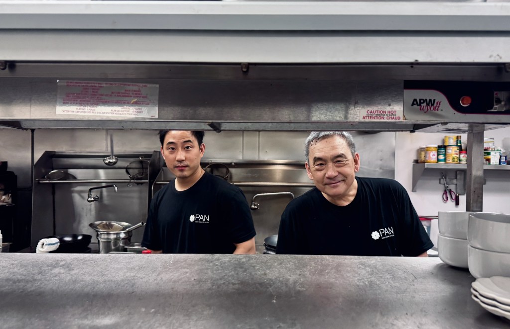 Howard Wang and his son Jarren in the kitchen.