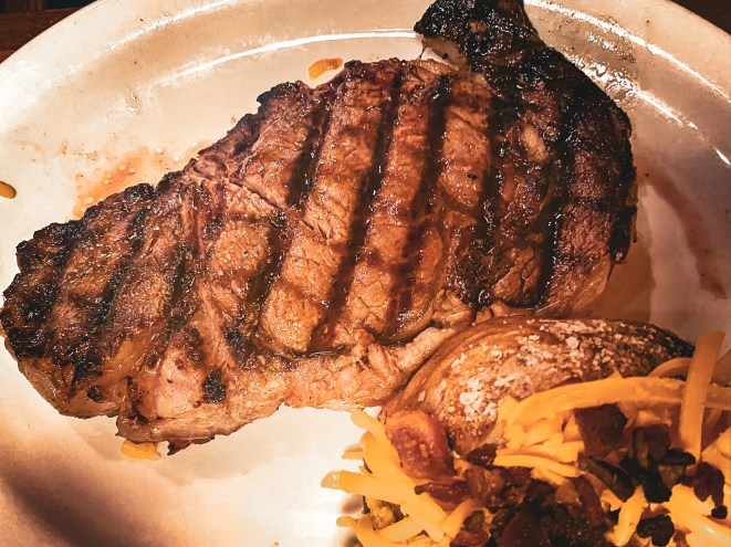 Texas Roadhouse steak meal with a baked potato