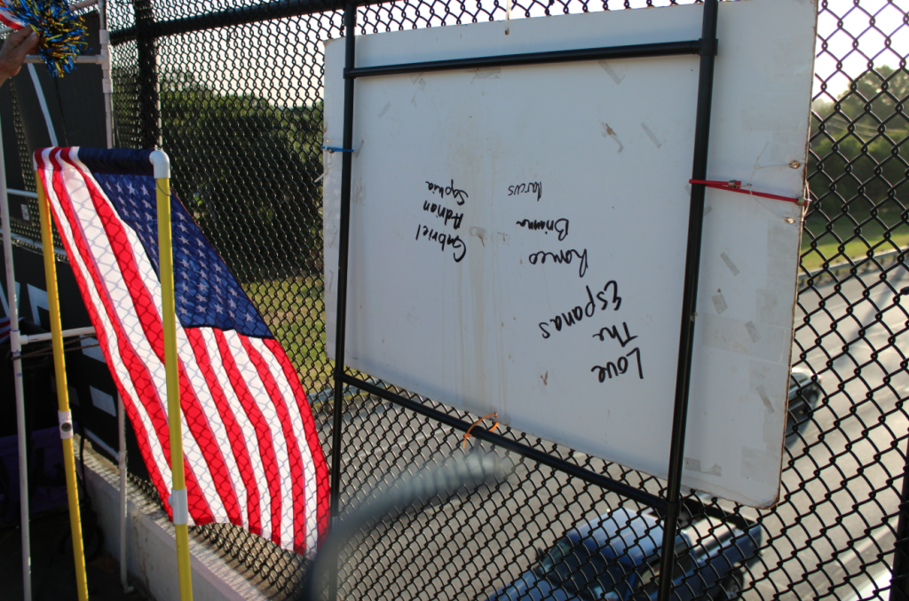 The backside of signs and flags, which are attached to PVC piping to comply with state regulations.
