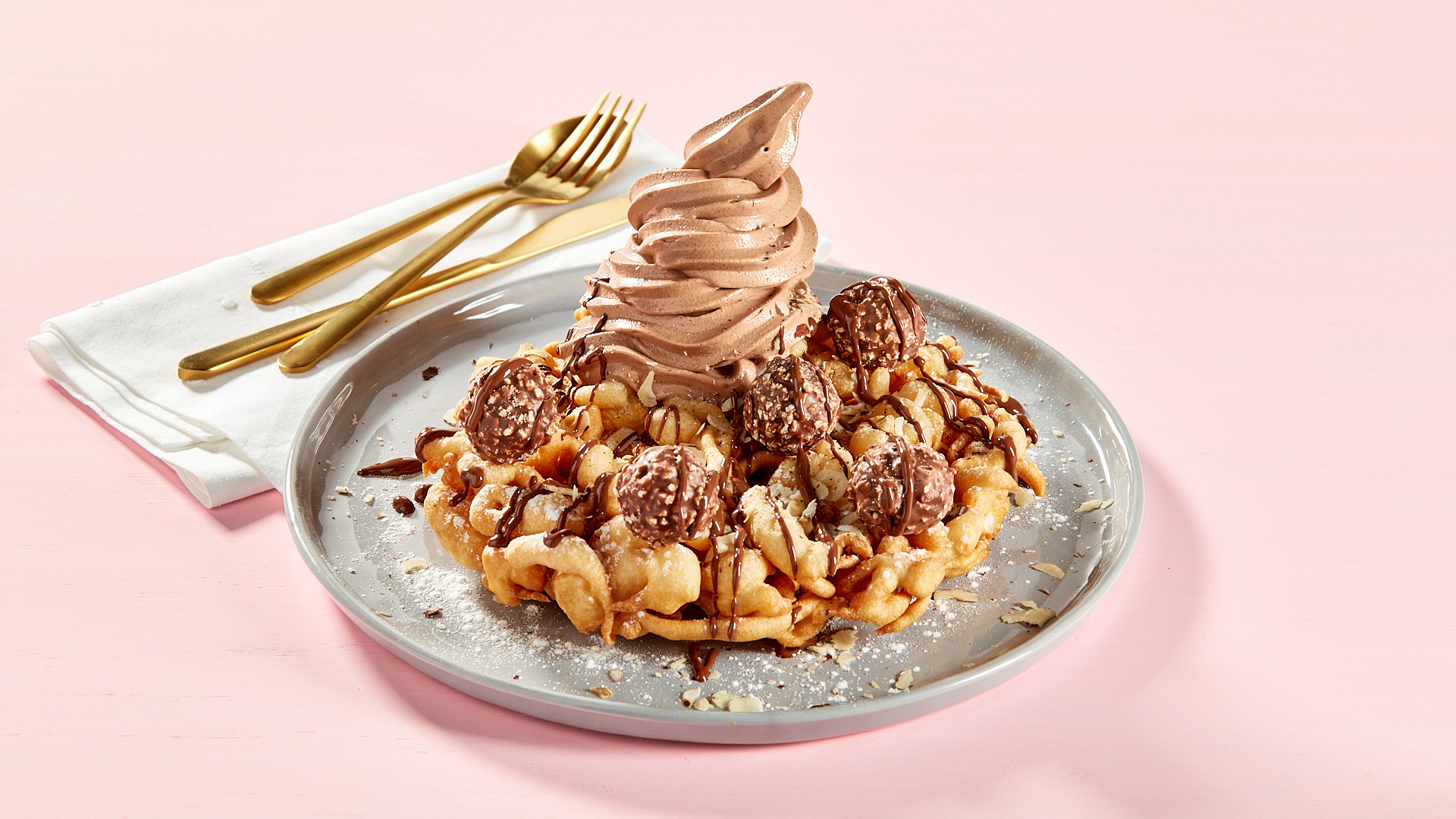 A waffle topped with chocolate and ice cream.