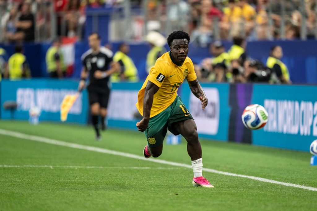 Nestory Irankunda of Australia attacks along the sideline