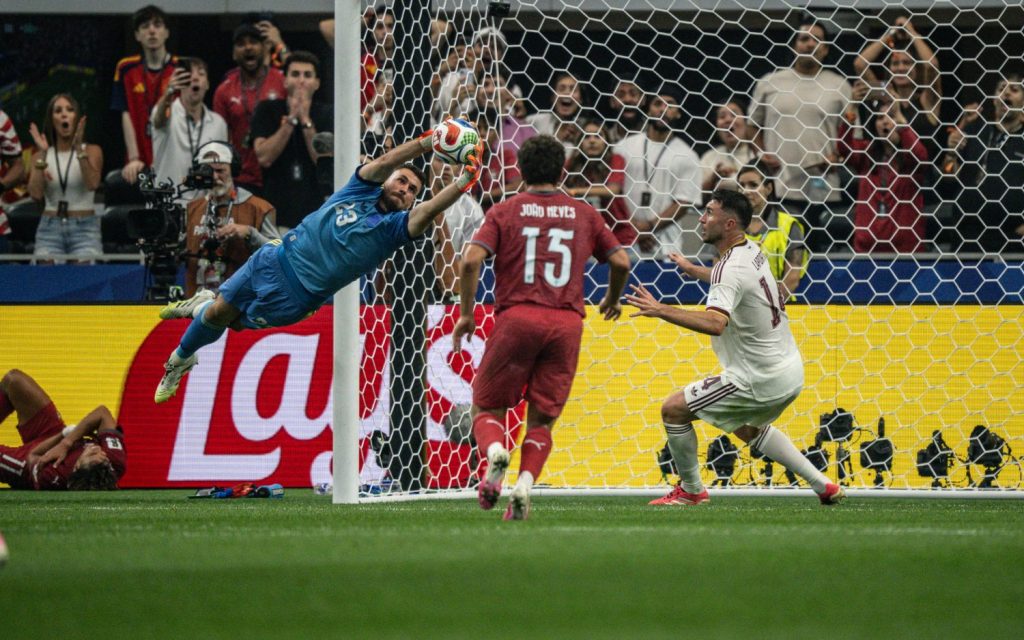 Spain goalkeeper Unai Simon (23) saves