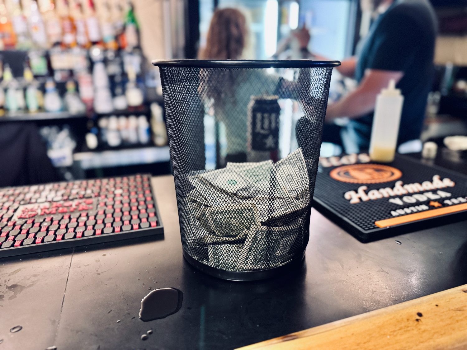dollar bill tips on the bar at Granda theater