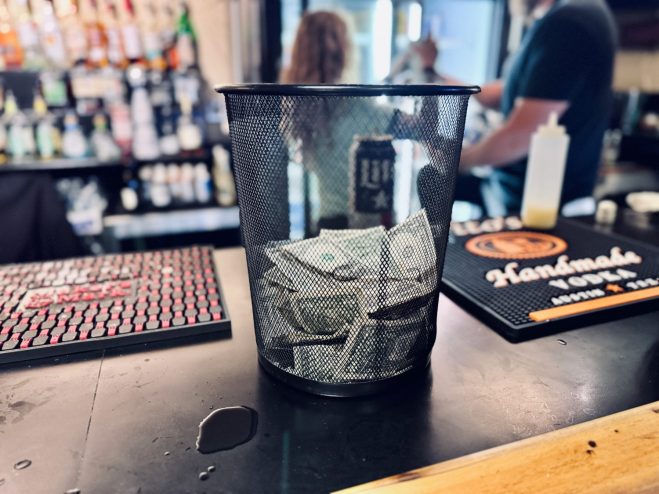 dollar bill tips on the bar at Granda theater