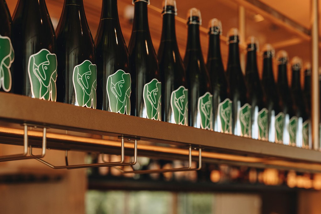 A shelf of private wine labels made exclusively for Wish You Were Here Group.