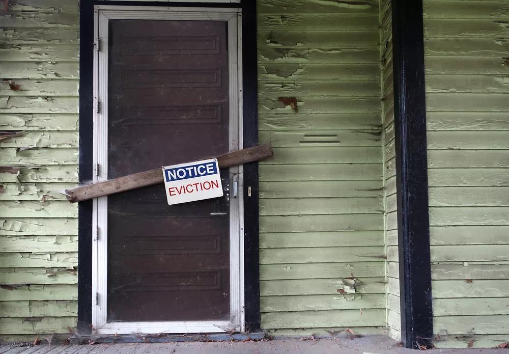 House door with an eviction sign