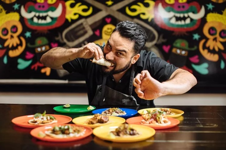 Regino Rojas of Purepecha in Dallas eats a taco.