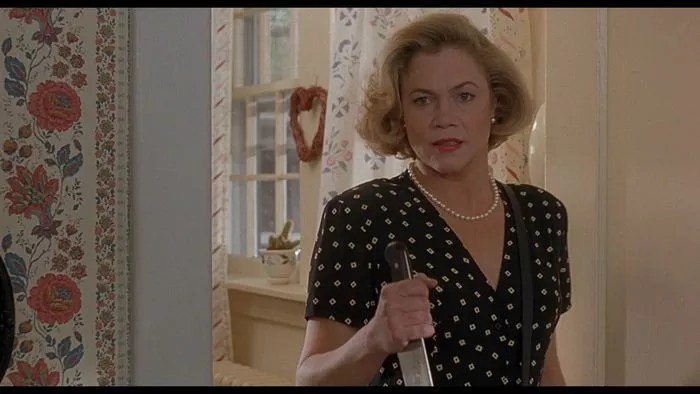 With <i>Serial Mom</i>, John Waters and Kathleen Turner Sliced Open the Boxes the World Puts Us in