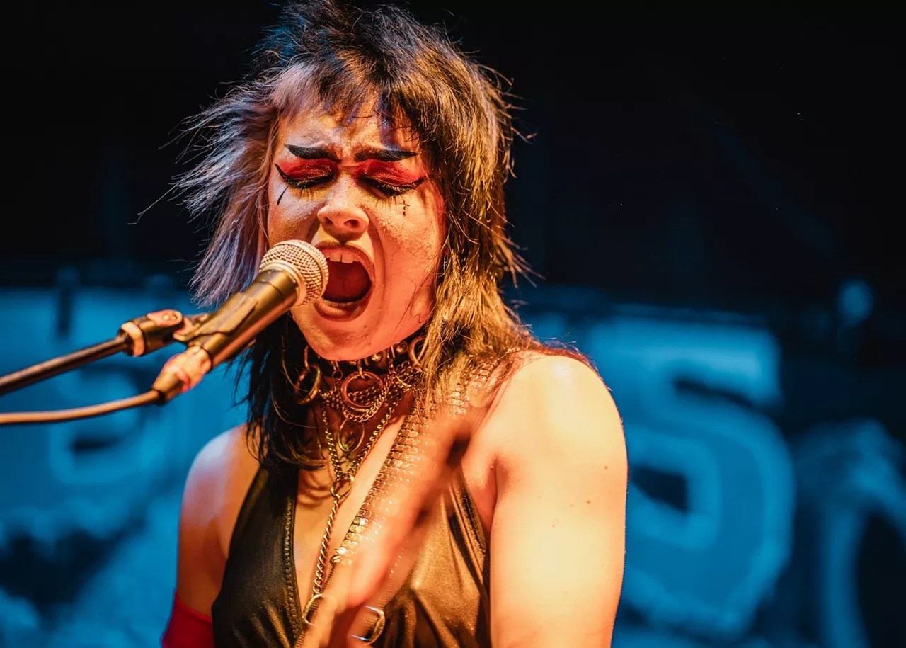 Leah Lane from Rosegarden Funeral Party singing onstage in Dallas.