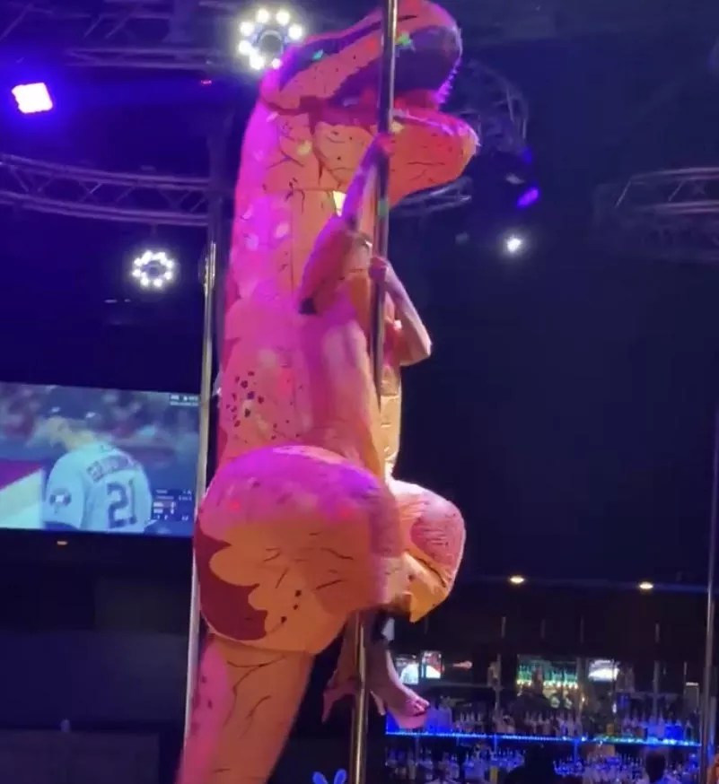 A Dallas Exotic Dancer Dressed as a Dinosaur Wins Halloween