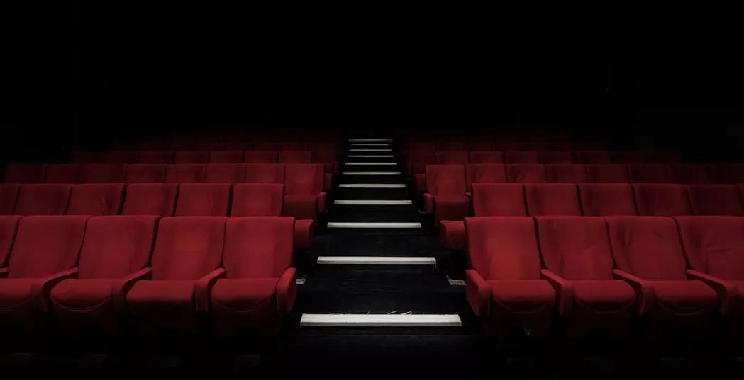 An empty movie theater with red seats. The North Texas Film Festival will not be returning.