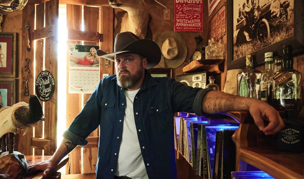 Man with cowboy hat posing