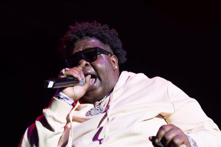 BigX Tha Plug performing live. The rapper collaborated with fellow Dallas artist Ro$ama on a song for Godzilla x Kong: The New Empire.