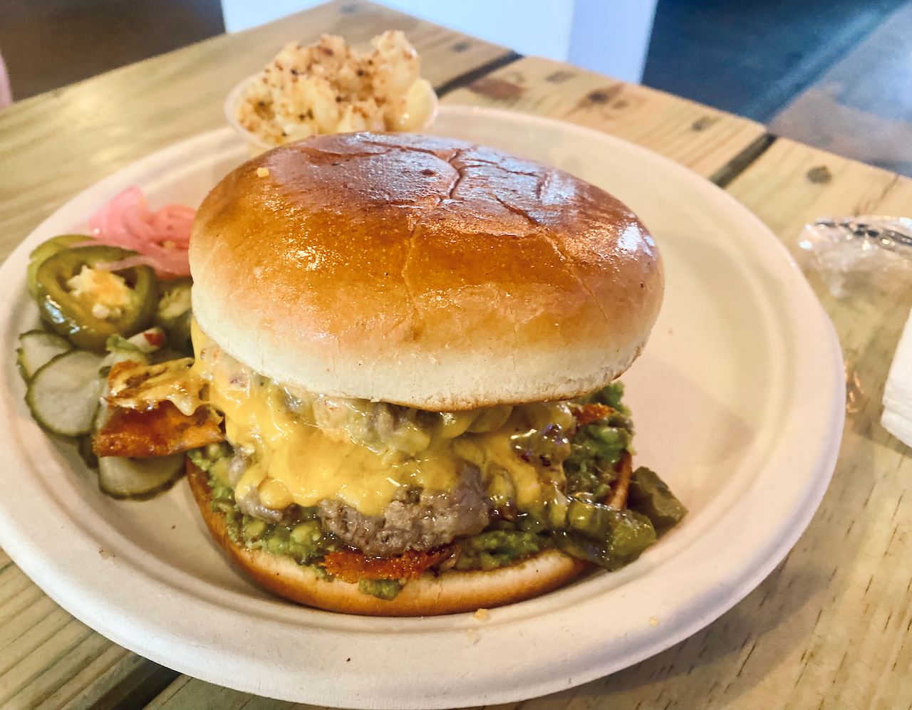 avocado smash brisket candied bacon burger from Smoke and Bone.
