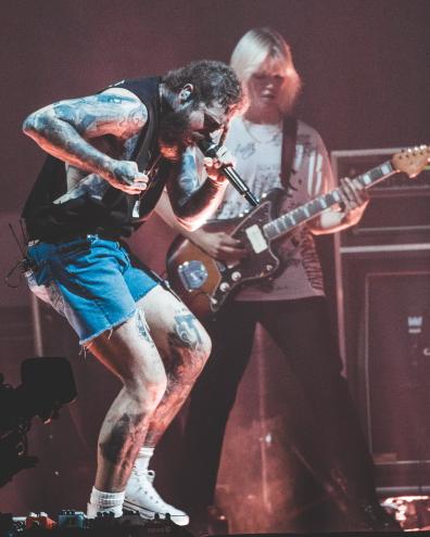 Post Malone dancing the night away at Dos Equis Pavilion in 2023.