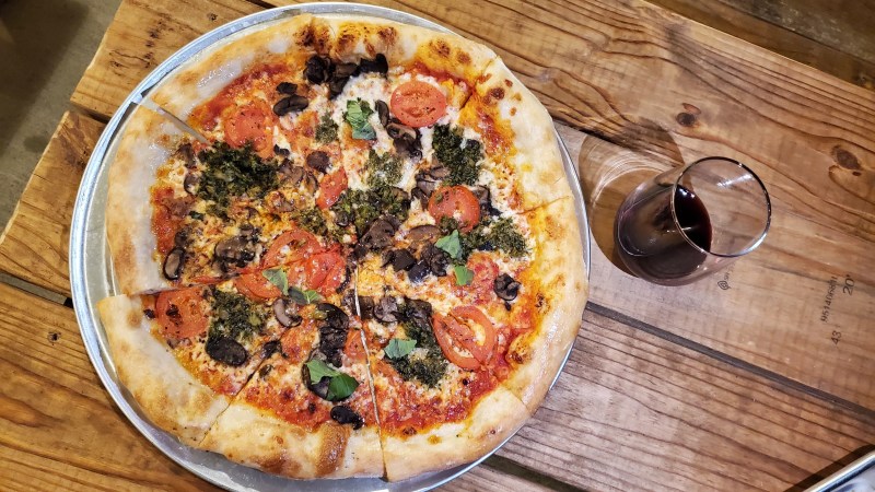 Cenzo's pizza and glass of wine