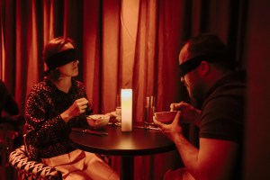 Diners at Dining in the Dark have blind folds over their eyes.