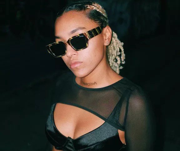 Dallas singer Alex Irish in dark sunglasses. The artist has a new EP.