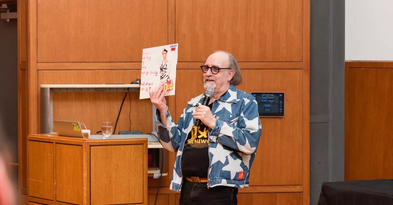 The legendary Malcolm Garrett, wearing a Vivienne Westwood design, speaking at the punk exhibition <i>Torn Apart </i>, currently on display in Dallas.