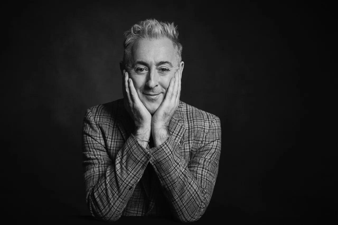 A black-and-white headshot photo of Scottish actor Alan Cumming, who is bringing his quirky showmanship to Dallas' Moody Performance Hall.