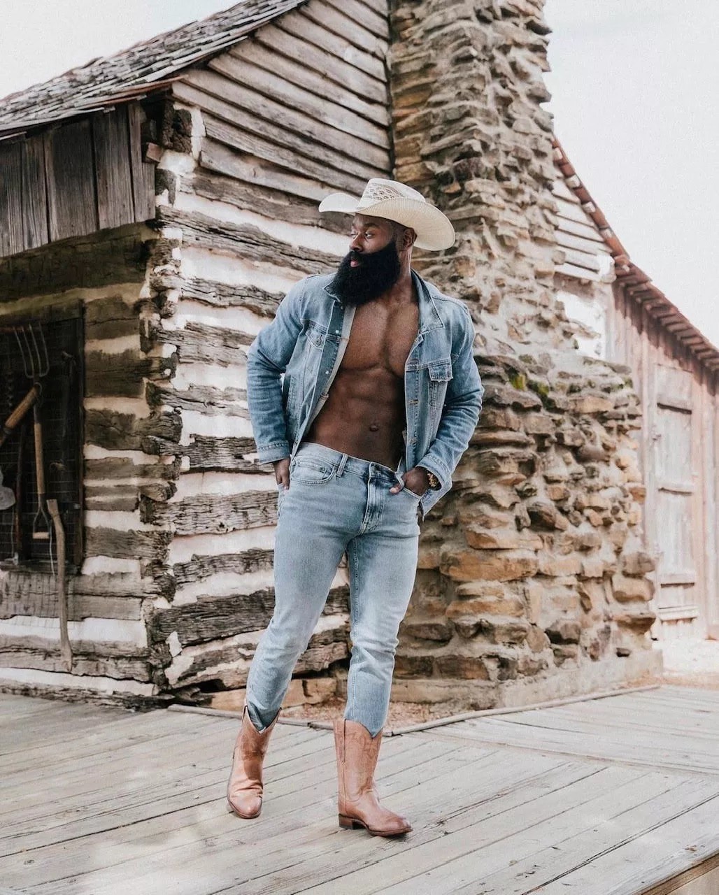 Men’s fashion influencer and Wilhelmina model Queyoun Makor in denim, cowboy boots and Stetson.