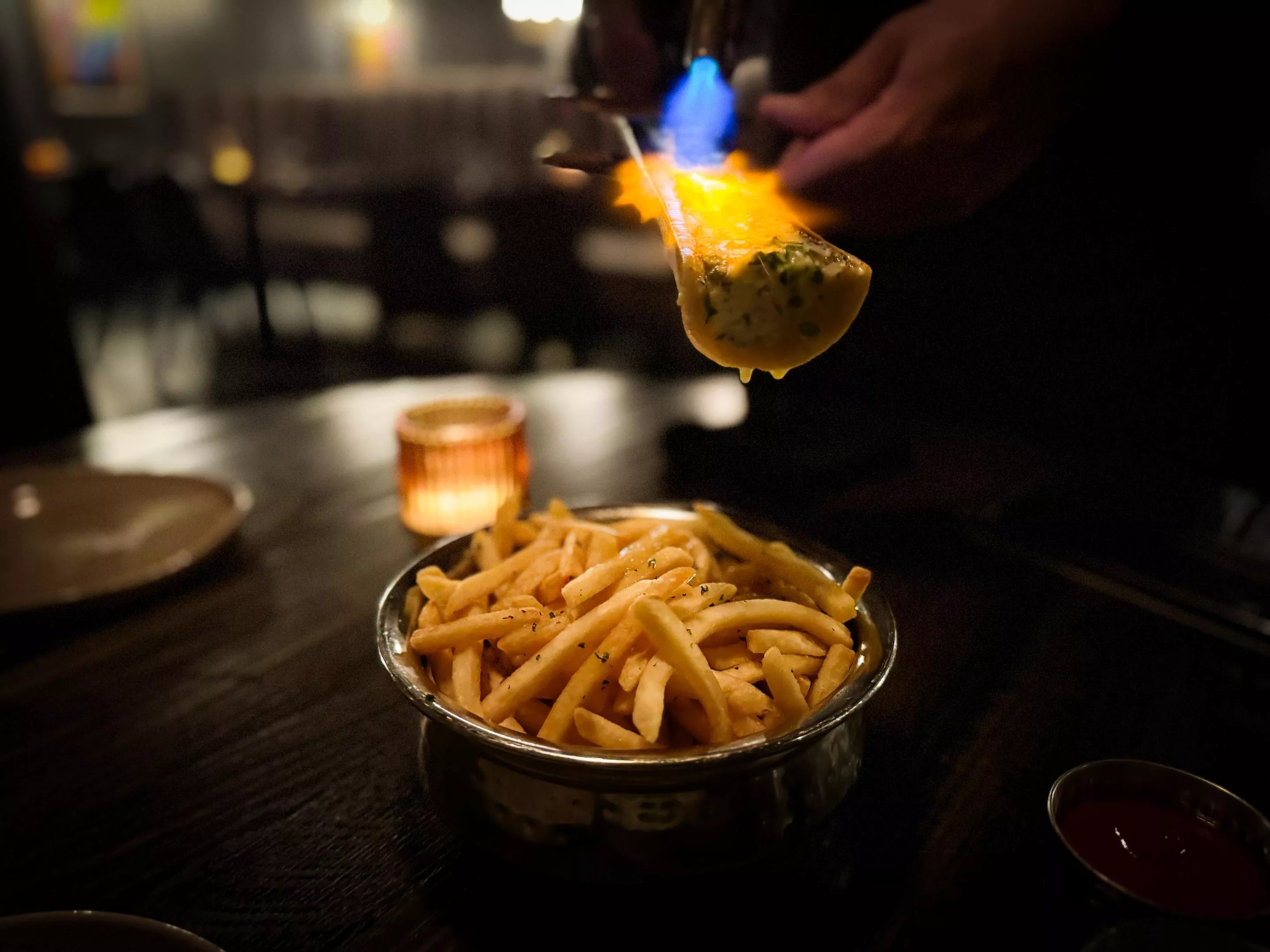 , referring to a handful of spaces that blur the line between restaurant and club along South Good Latimer just outside of Deep Ellum.