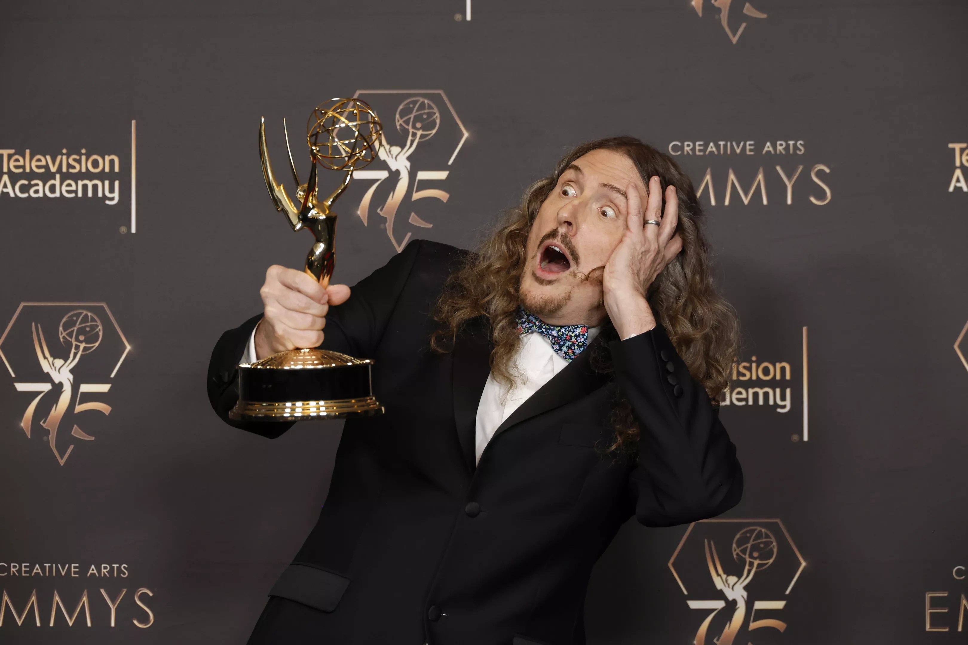 'Weird Al' Yankovic poses with the Outstanding Television Movie award during the 2024 Creative Arts Emmys at Peacock Theater on January 06, 2024 in Los Angeles, California.