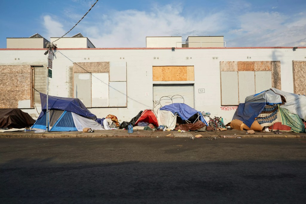 Downtown homeless volunteers say they are 'not going to be bullied' amid crackdown