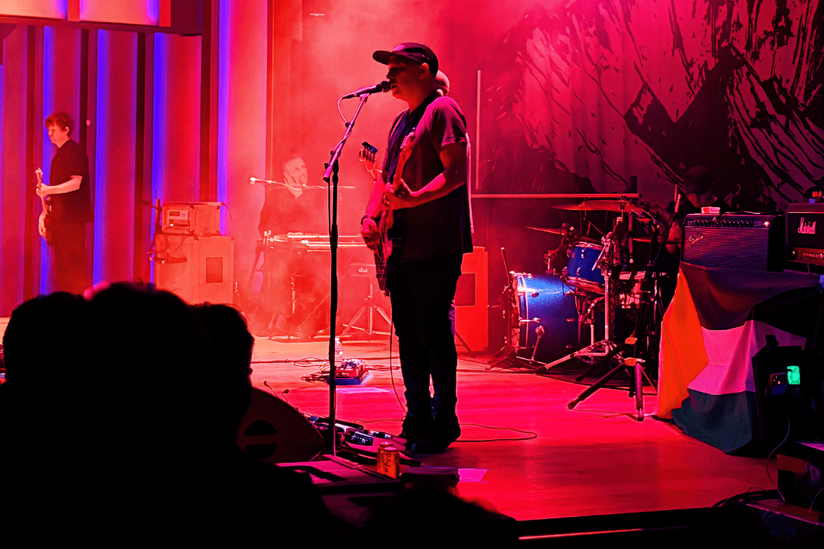 Man on stage performing in front of crowd